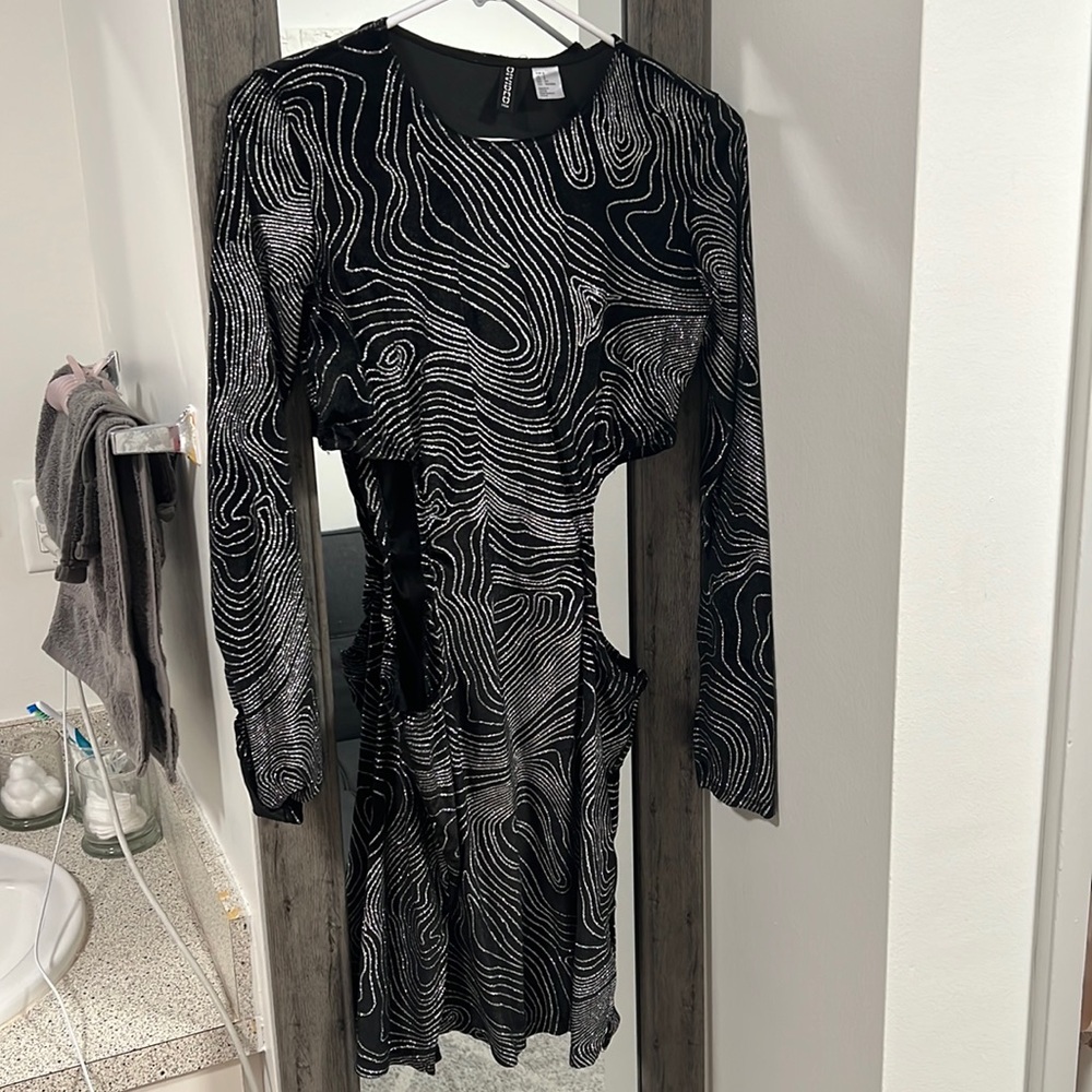 Black velvet dress with side cut outs. Super cute for a night out. Size small.